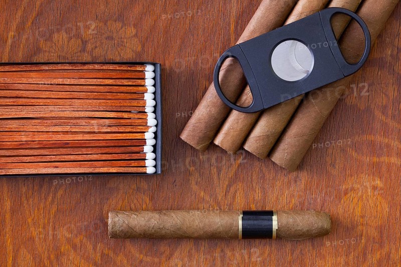 Different cigars on the decorative wooden table