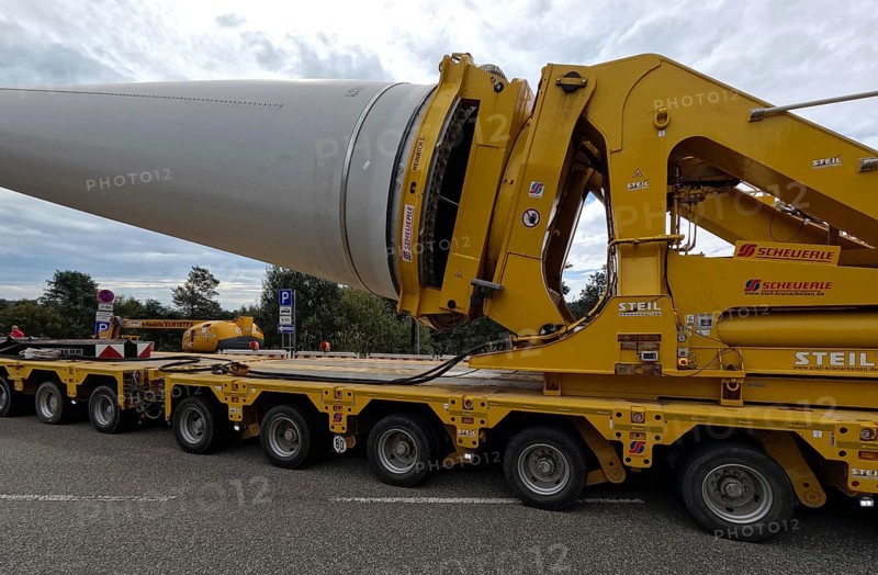 The heavy transport of the 68-metre-long rotor blades leads over the Feldberg (Breisgau-Hochschwarzwald district) to Freiburg's local mountain, the Schauinsland The rotor blades are mounted on a self-propelled transporter and travel at walking pace over several days to their destination Wind energy theme image, Feldberg in the Black Forest, Germany, Europe
