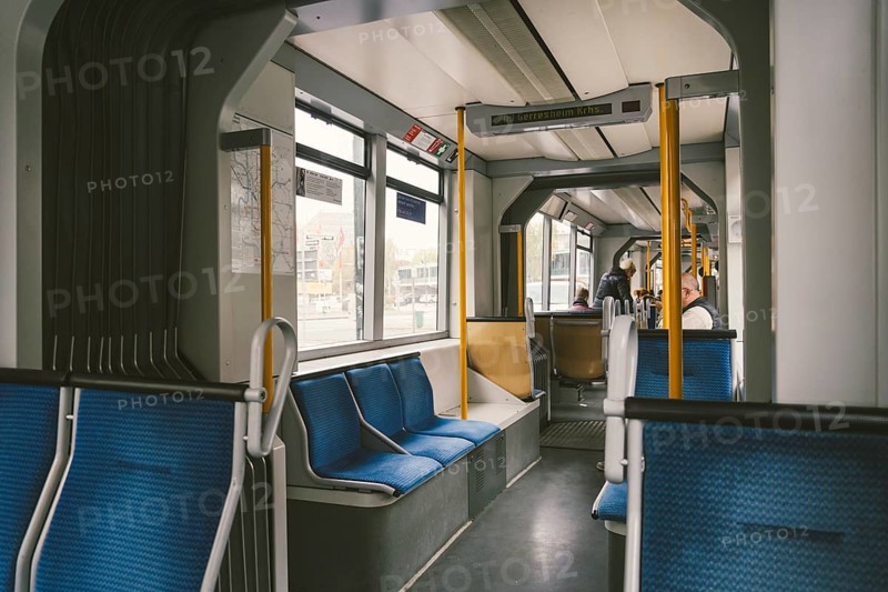 High-speed tram on the city street. Modern Tram In Dusseldorf, Germany October 20, 2018. Tram inside view, passenger compartment with passengers during a ride in Germany