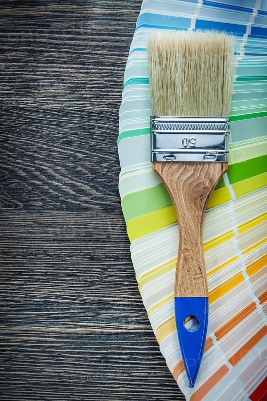 Paintbrushes color pantone fan on wooden board