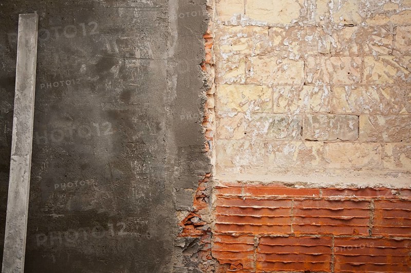 Brickwall construction and mortar cement plaster with rulers
