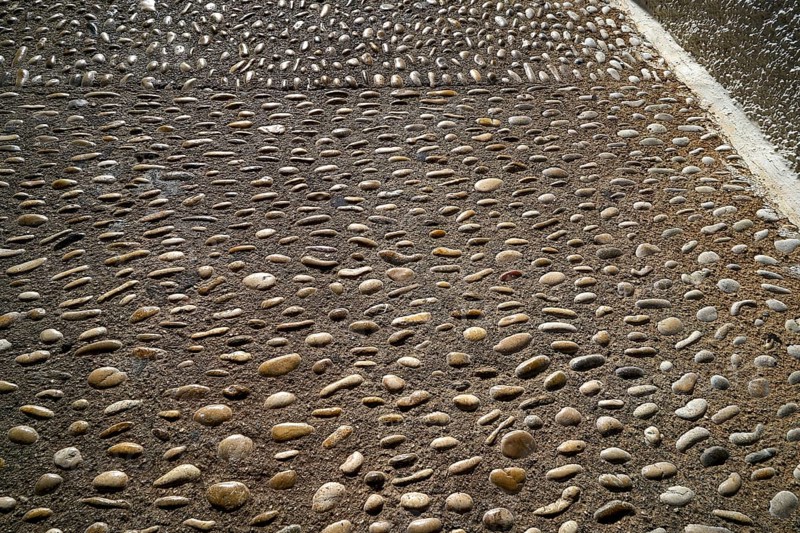 Altea soil rolling stone mosaic on flooring of Alicante Spain