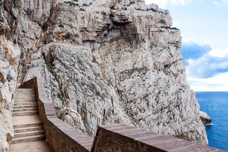 The incredible staircase of Neptuno cave in the morning. Alghero, Sardinia. Italy