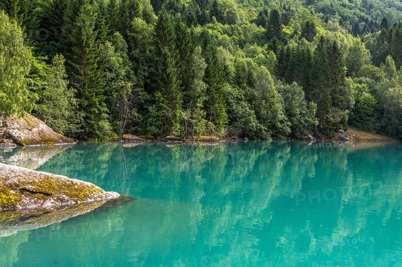 The Kjenndalsbreen is part of the Jostedalsbreen, one of the largest glaciers in Norway, and forms an impressive mountain landscape with a beautiful lake in Sande. The glacier Kjenndalsbreen with a lake in Norway is a beautiful place to travel to in summertime