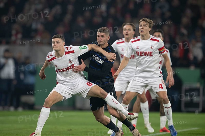 BEAUTIFUL SPORTS/ (DFL/DFB REGULATIONS PROHIBIT ANY USE OF PHOTOGRAPHS AS IMAGE SEQUENCES AND/OR QUASI-VIDEO) Cologne, RheinEnergieStadion, North Rhine-Westphalia, Eric Martel (1.FC Köln, midfield, #6), Marton Dardai (Hertha BSC, defence, #31), Timo Hübers (1.FC Köln, defence, #4), DFB-Pokal 1.FC Köln, Hertha BSC on 04.12.2024 at RheinEnergieStadion in Cologne Germany