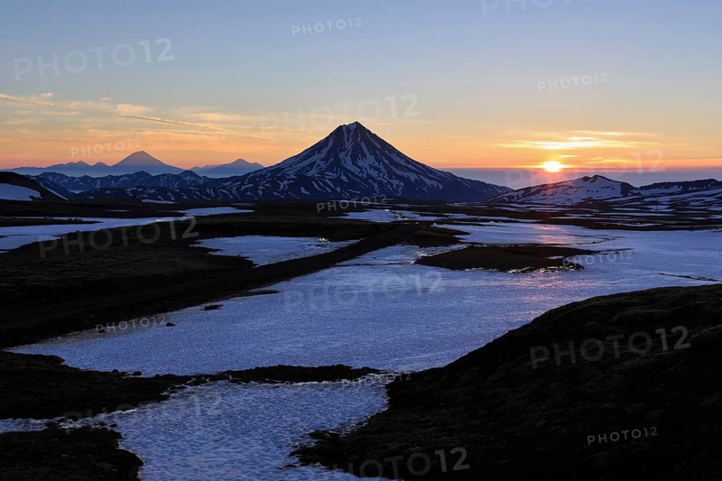 Volcanic landscape of Kamchatka Peninsula: beautiful sunrise over Viluchinsky Volcano. Asia, Russian Far East, Kamchatka Peninsula
