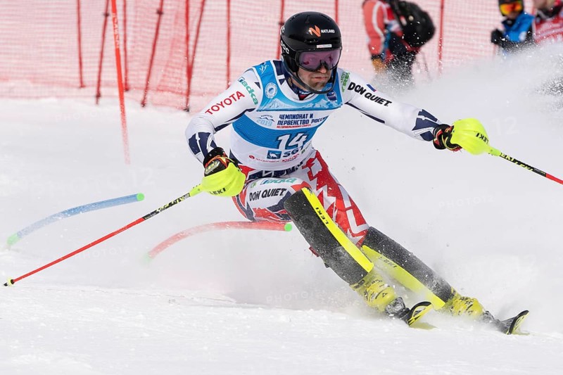 MOROZNAYA MOUNTAIN, KAMCHATKA PENINSULA, RUSSIAN FEDERATION, MARCH 28, 2019: Mountain skier Krystof Kryzl Czech skiing down mount slope. International Ski Federation Championship, slalom