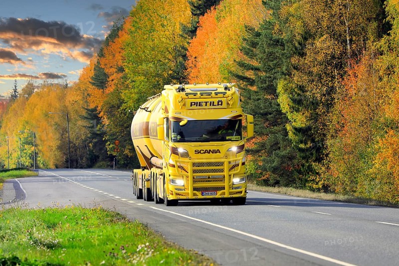 Beautifully customized yellow brown Nextgen Scania tank truck for bulk transport on Highway 10 on a day of autumn. Tammela, Finland. October 2, 2020
