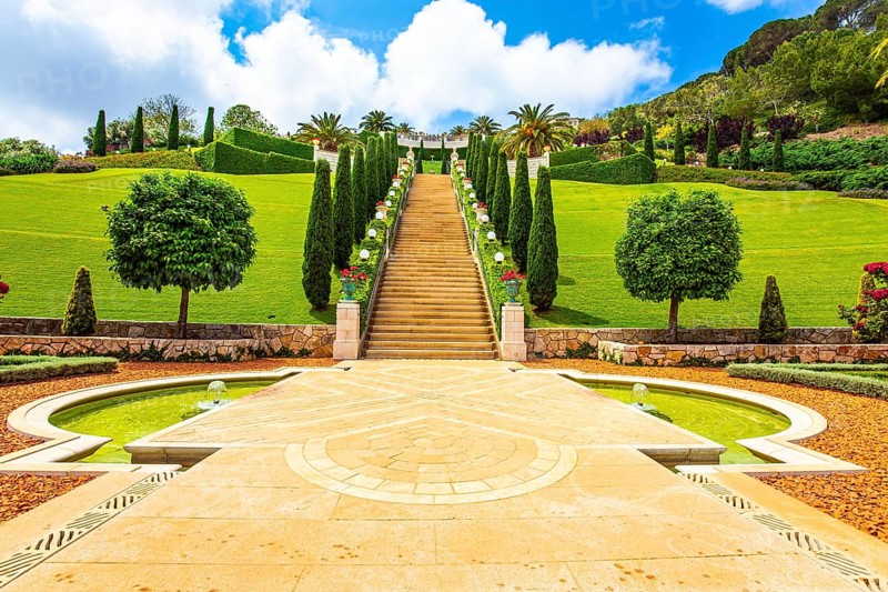 Bahai World Center. Pilgrimage center and popular tourist destination. Clear sunny day by the sea. Marble staircase and rows of cypress trees on Mount Carmel. Haifa, Israel, Asia