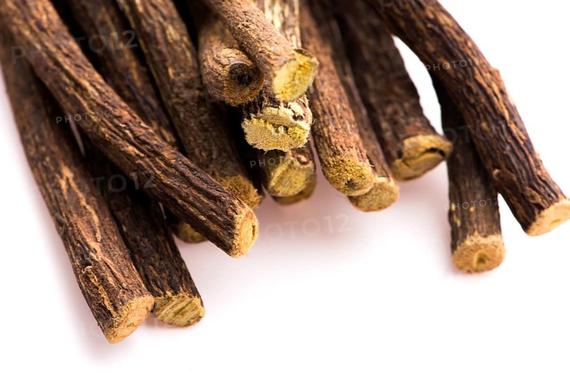 Licorice roots on white background