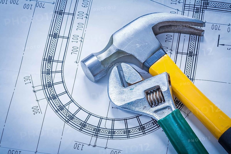 Claw hammer adjustable key on blueprint building and architecture concept