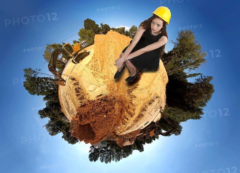 A Female Construction Worker on a job site wearing a hard hat
