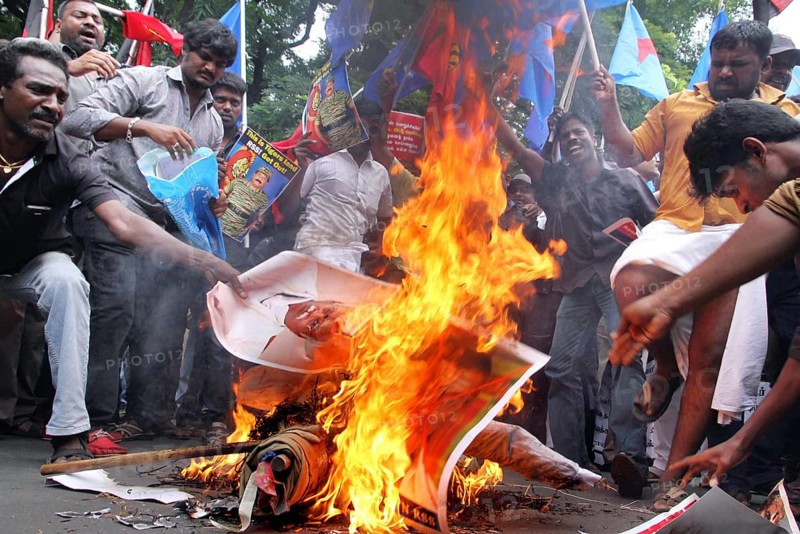 Supporters of several Tamil nationalist parties burn effigies stage protest against the Kaveri water sharing issue Chennai