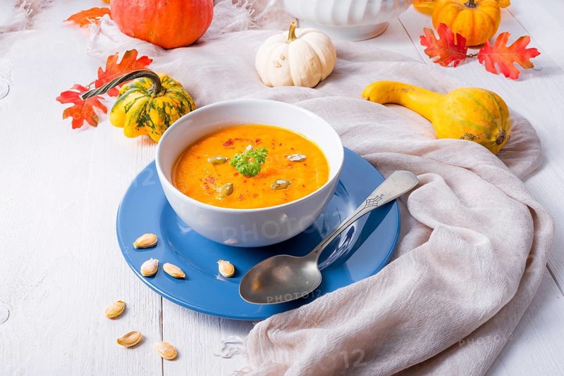 Healthy pumpkin soup with ginger carrots and coconut milk