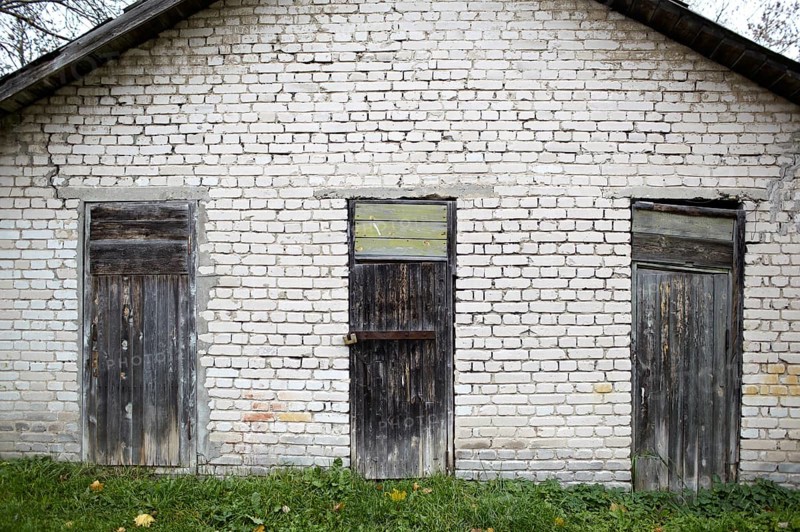 Three doors in the old grey brick garage