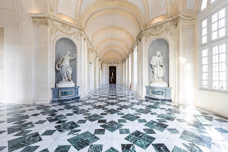 Venaria Reale, Italy, January 2023: luxury interior old royal palace. Gallery perspective with window, Europe