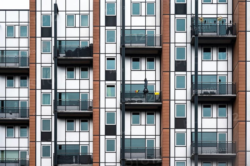 Leuven, Flemish Brabant Region, Belgium, April 1, 2023, Facade with windows and balconies of a social housing apartment block, Europe