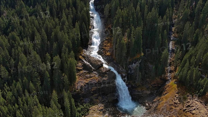 Aerial view of Krimml Waterfalls on sunny day. High Tauern National Park, Austrian Alps, Austria, Europe