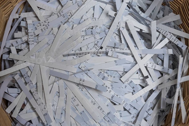 Shredder has destroyed top secret data - close-up of paper shredder