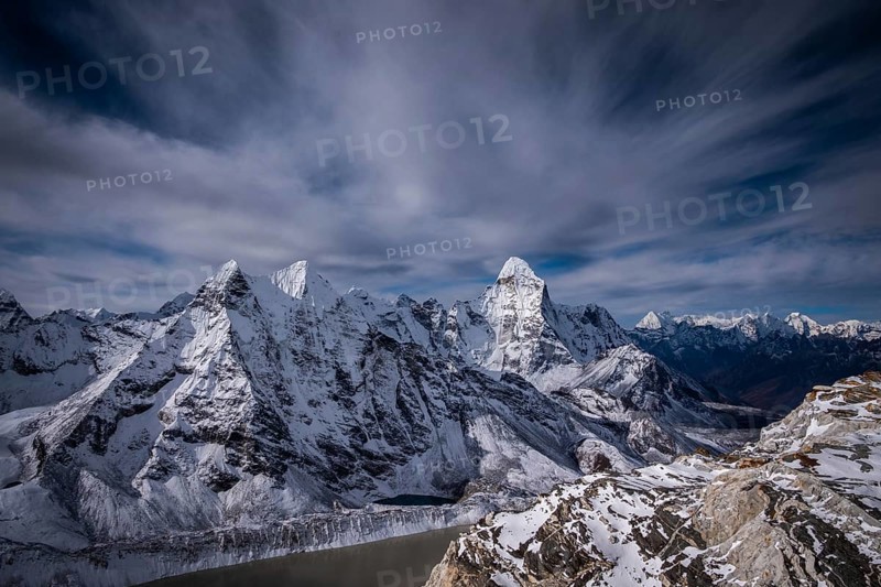Ama Dablam and other Mountains and Dramatic Sky. Nepal, Himalaya