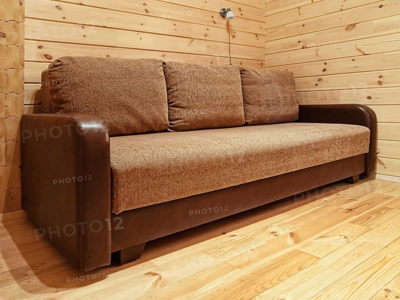 Single sofa in the log house bedroom