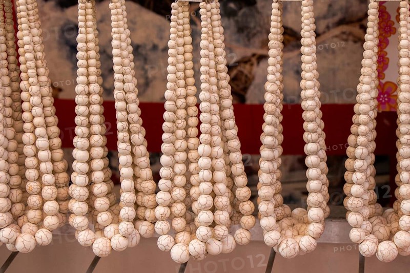 Handcrafted necklace. String of beads in various colors. Colorful beads necklaces