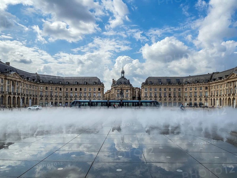 BORDEAUX/FRANCE - SEPTEMBER 19 : Miroir d'Eau at Place de la Bourse in Bordeaux France on September 19, 2016. Unidentified people