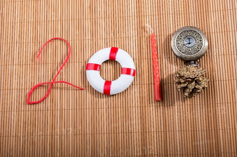 Happy Year 2018 decoration with life preserver, coins, cone and watch