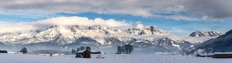 Snowy mountains, meadow and a hut, landscape in Austria, panorama