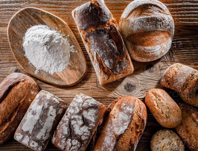 Composition with assorted bakery products on wooden table