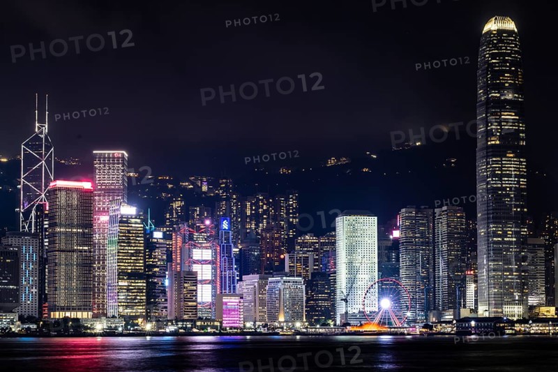 HONG KONG, CHINA - SEPTEMBER 27 2024: Night time view of Hong Kong Island and Victoria Harbour from Kowloon on a autumn evening, Hong Kong, China, Asia