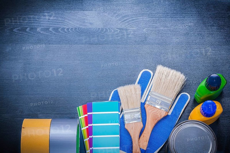 Set of painting tools on wooden board construction concept