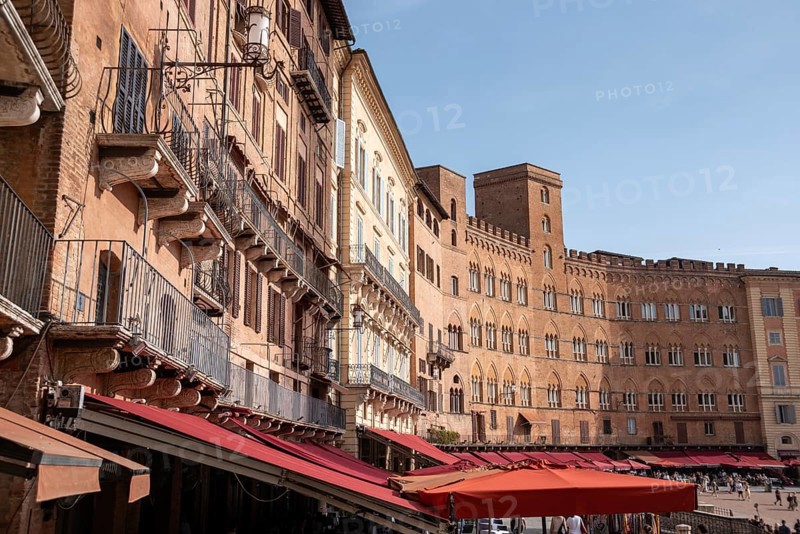 Old medieval brick houses surrounding the famous Piazza del Campo in the center of Siena, Italy, Europe