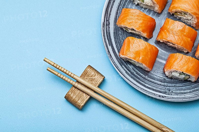 Rolls Philadelphia With Salmon Eel On Blue Background
