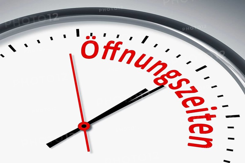 Eine Uhr mit Text Zeit Oeffnungszeiten