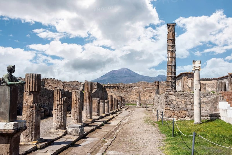 POMPEII, ITALY, MAY 04, 2022, Colonnade and sculptures of the Temple of Apollo near the Pompeian forum, Southern Italy