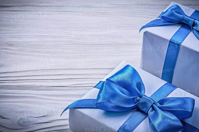 Set of present boxes on wooden board celebrations concept