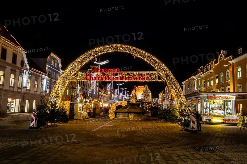 Archway, illuminated entrance to the Christmas market, night shot, main square of Leoben, Styria, Austria, Europe