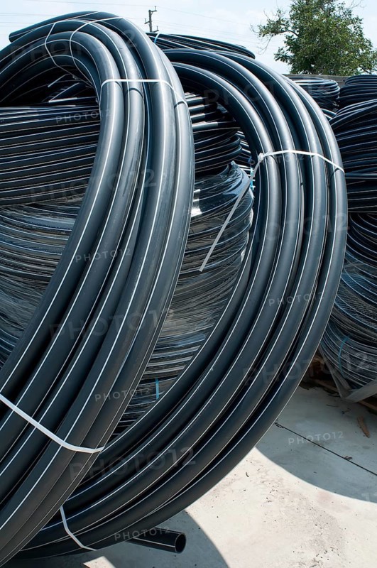 Coiled black PVC hoses. Polyethylene tubing