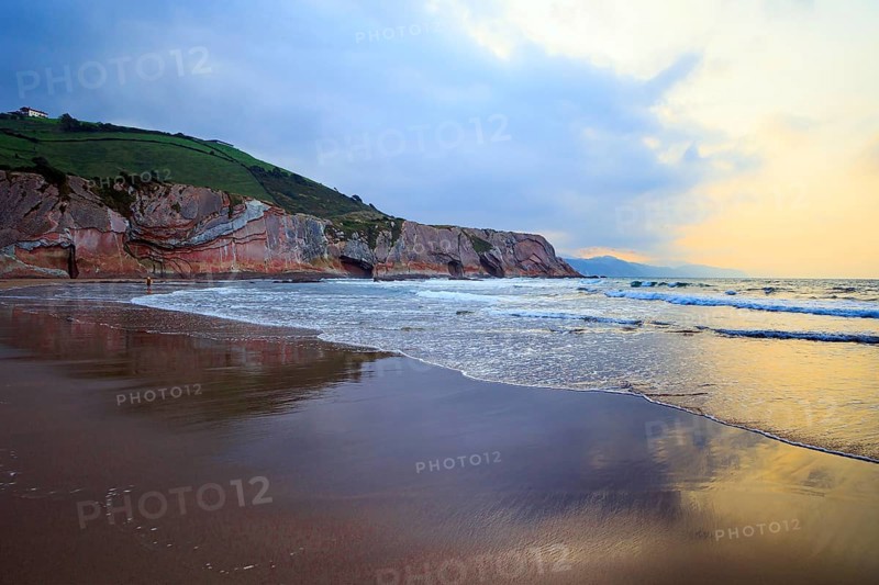 Low tide in the Atlantic. Playa Zumaya. Flysch - unique landscape of underwater rocks exposed at low tide. The Basque Country - Itsurun. Incredibly bizarre coastal cliffs