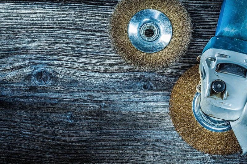 Rotary wire brushes on vintage wooden board