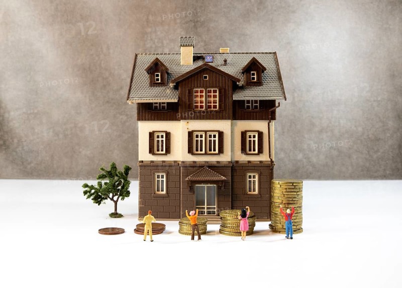 The house prices keep rising every time, this photo is a concept with coins to shop the expensive houses