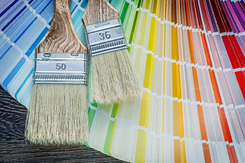 Set of color sampler paintbrushes on wooden board