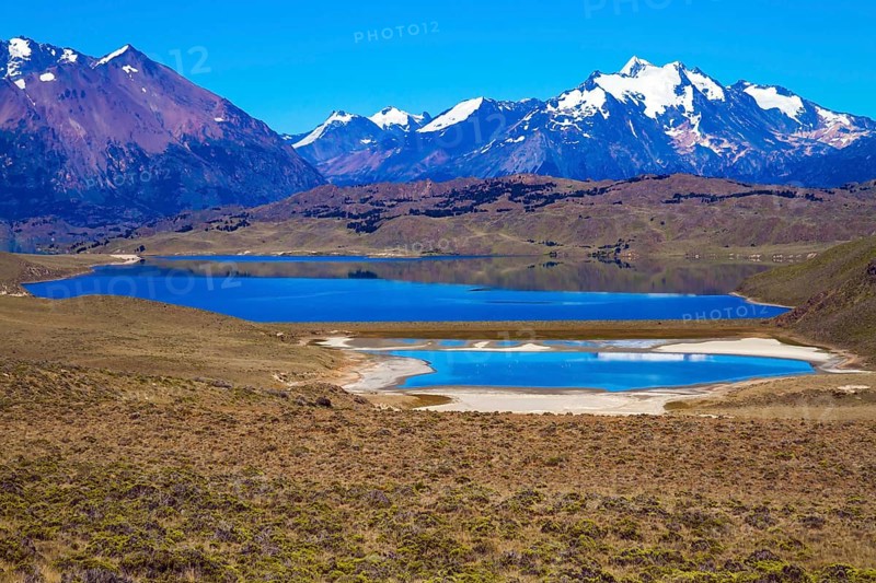 Los Glaciares is Argentina's most beautiful natural park. Pampas surround snow-capped mountains. Huge lake with azure water and arid steppe of Patagonia