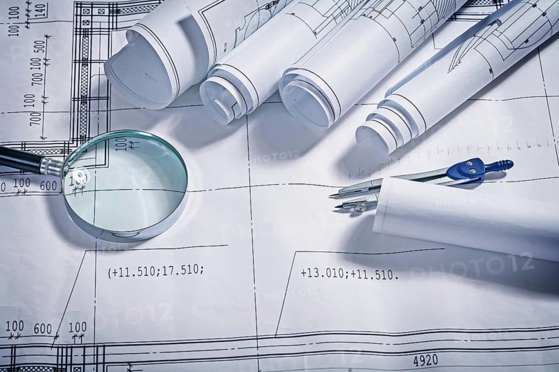 Blueprints magnifer and compass close up