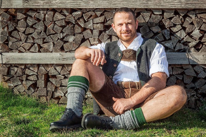 An image of a traditional bavarian man is taking a rest
