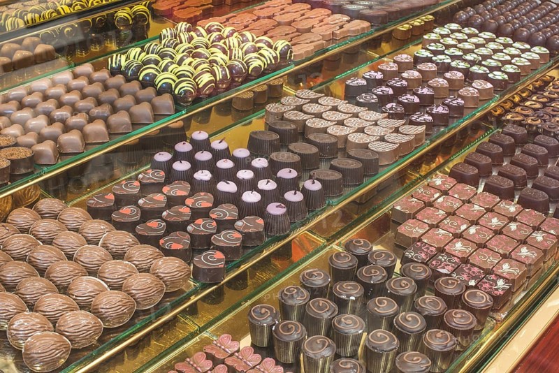 Chocolate candy in a store window. Stand with chocolates. Bulgaria