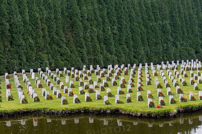 Atop a hill, a veterans cemetery with white headstones and the American flag evokes deep honour, sacrifice, and enduring national pride, Salisbury, United States of America
