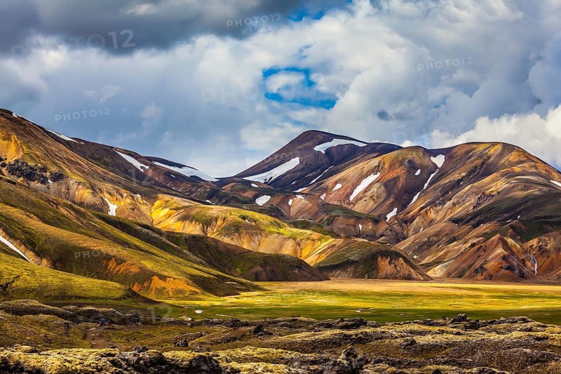 Valley National Park Landmannalaugar. On the gentle slopes of the mountains are snow fields and glaciers. Magnificent Iceland in the summer