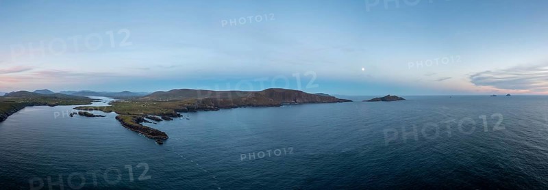 Panorama drone view of the Iveragh Peninsula with Valentia Island and Portmagee at sunset